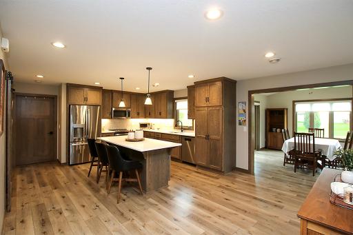 Pendant lighting, accenting the gorgeous quartz counter on the large island!
