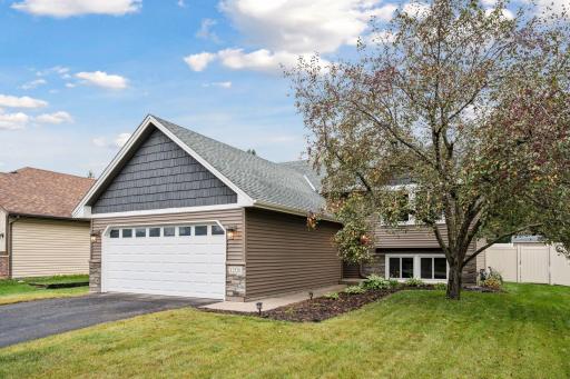 This home has curb appeal with stone accents, shakes and vinyl siding