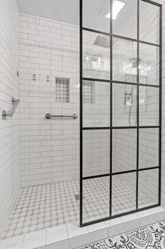 Main floor shower with immaculate tile work