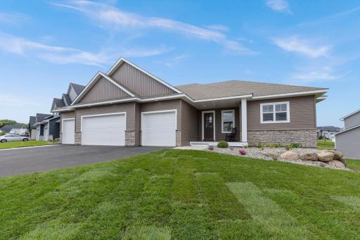 This custom-built, single-story residence with a finished walkout basement offers luxury living with a seamless blend of functionality, comfort, and timeless style.