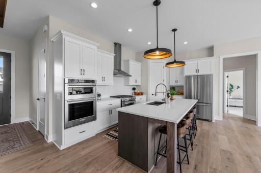 At the heart of the home lies the gourmet kitchen, designed to impress and inspire.