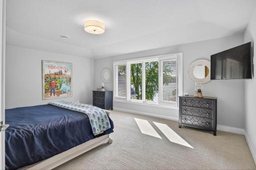 Secondary owner's suite with duel closet's and spa bath.