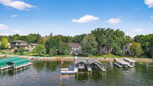 Welcome home to 5133 Emerald Drive on Lake Minnetonka’s coveted “Gold Coast” of Cooks Bay. This stunning property boasts .47 acres with 106 ft of premium, south-facing, level lakeshore.