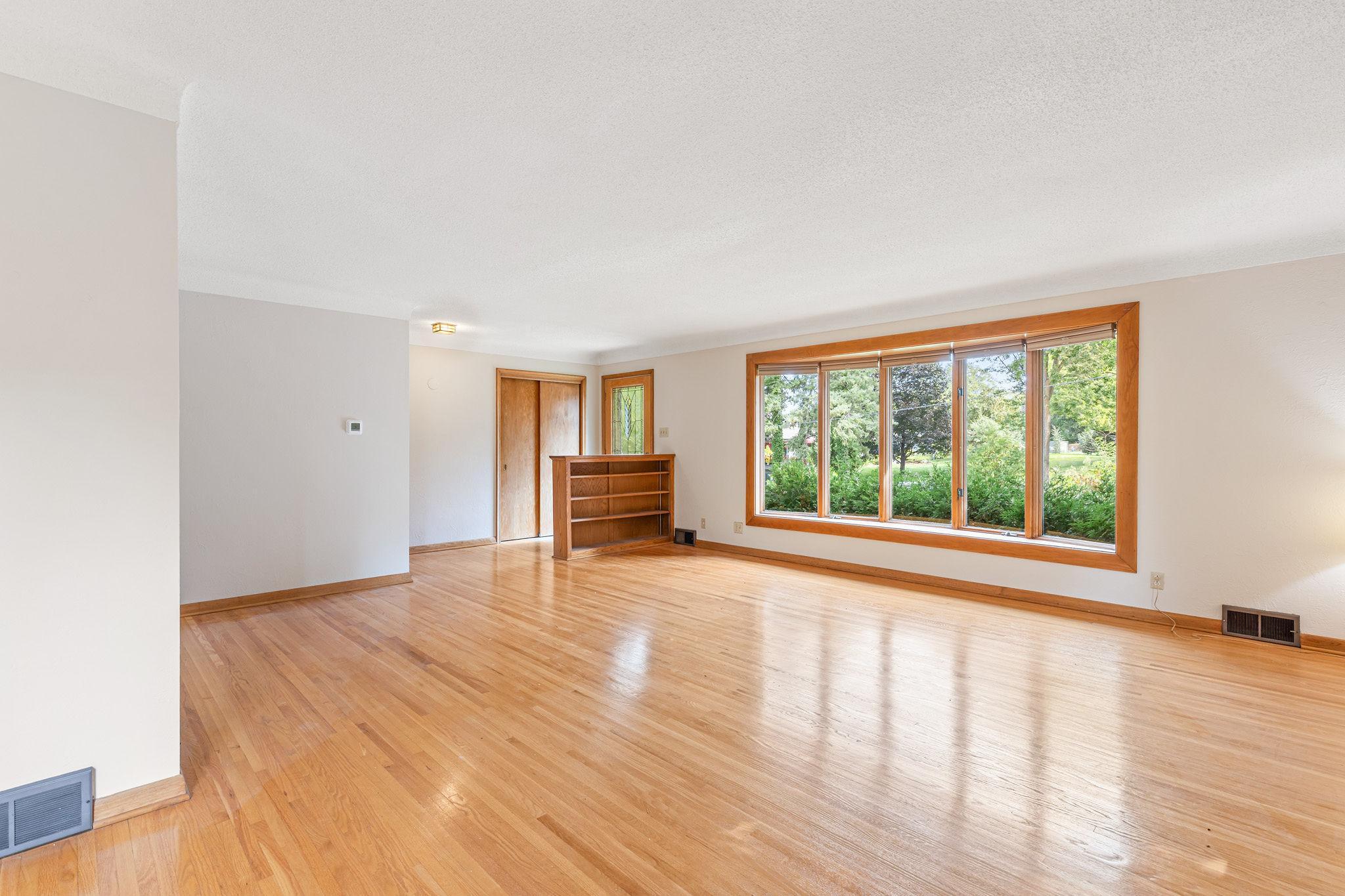 Built in bookcase separates the entry with coat closet