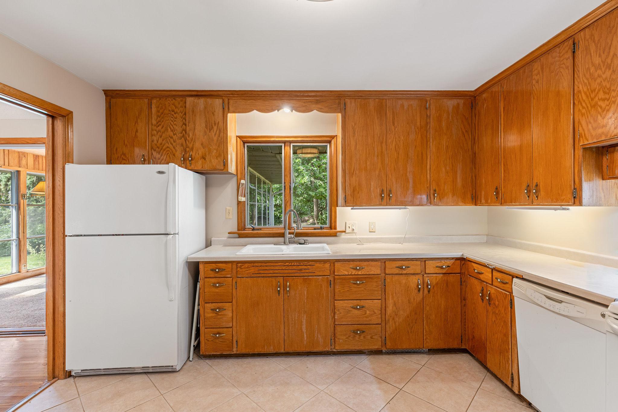 Square kitchen with window above sink