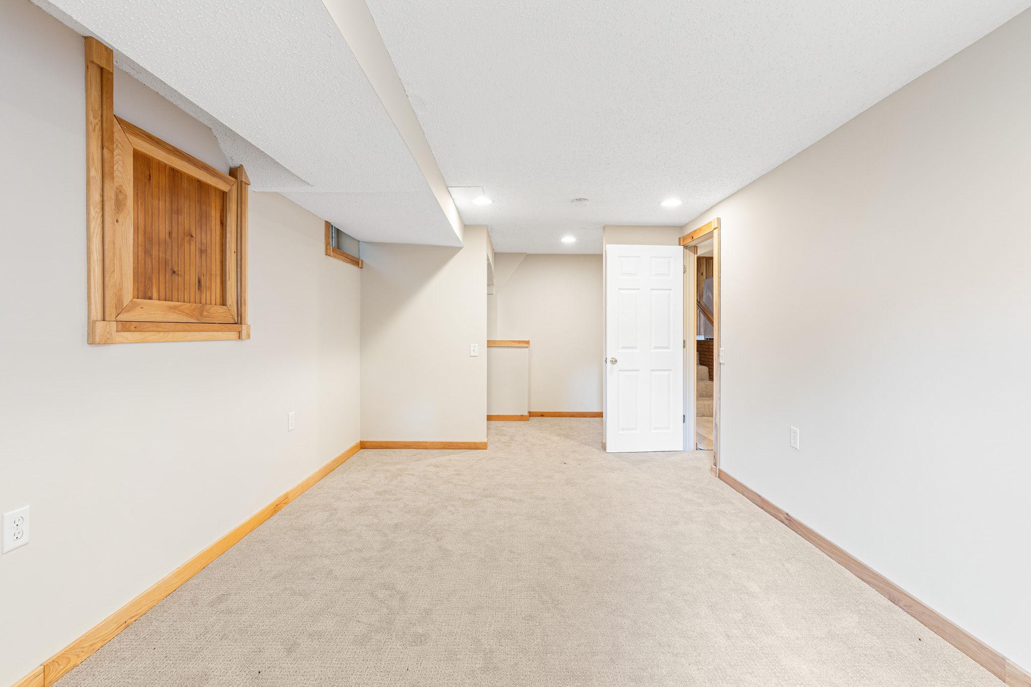 Walk in closet in lower level bedroom