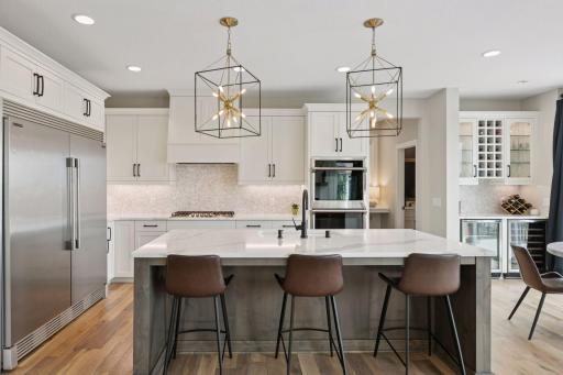 The gourmet kitchen is a showstopper with premium appliances, stunning countertops, and a large center island.