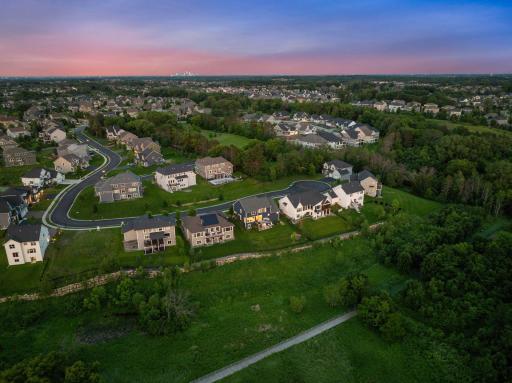 Backing up to rolling acres, this home offers unparalleled privacy and serene views.