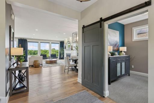 Located just off the entry, the office features a charming barn door that offers both style and privacy.