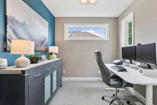 This versatile space boasts neutral carpeting and paint, and large windows for abundant natural light.