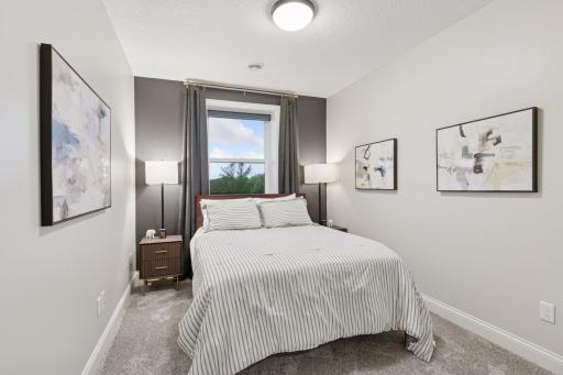 The fifth bedroom, located on the lower level, is ideal for older children or providing guests with a private and comfortable stay.