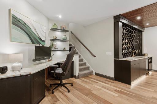 A built-in desk with quartzite top offers an additional workspace in the lower level.