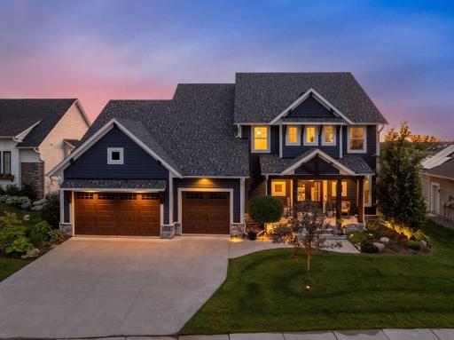 On the exterior, this meticulously designed home features elegant stone and LP siding with oversized windows the flood the open-concept interior with natural light.