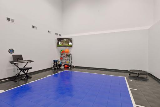 The large 24x22 sports court has huge windows to brighten up this space even more.