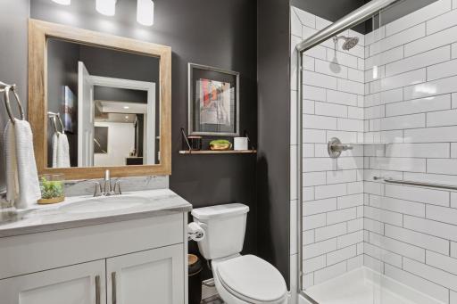 Tasteful and convenient lower level 3/4 bathroom.