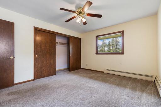 The primary boasts a fairly large closet space and ceiling fan for added comfort