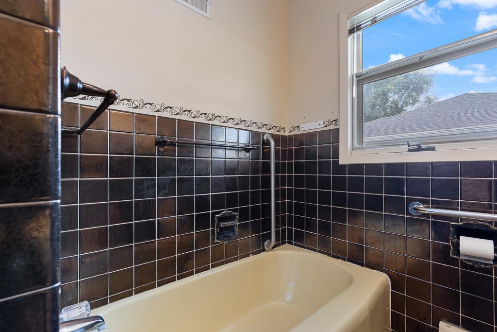 Handicap accessible with grab bars in place