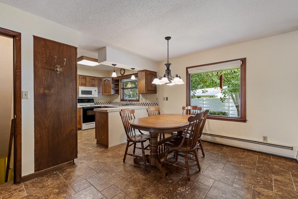 Great dining space area with large window looking out to the backyard