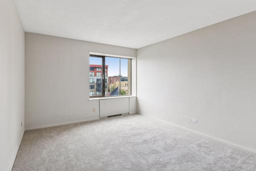 Spacious Bedroom with new window, carpet and fresh paint