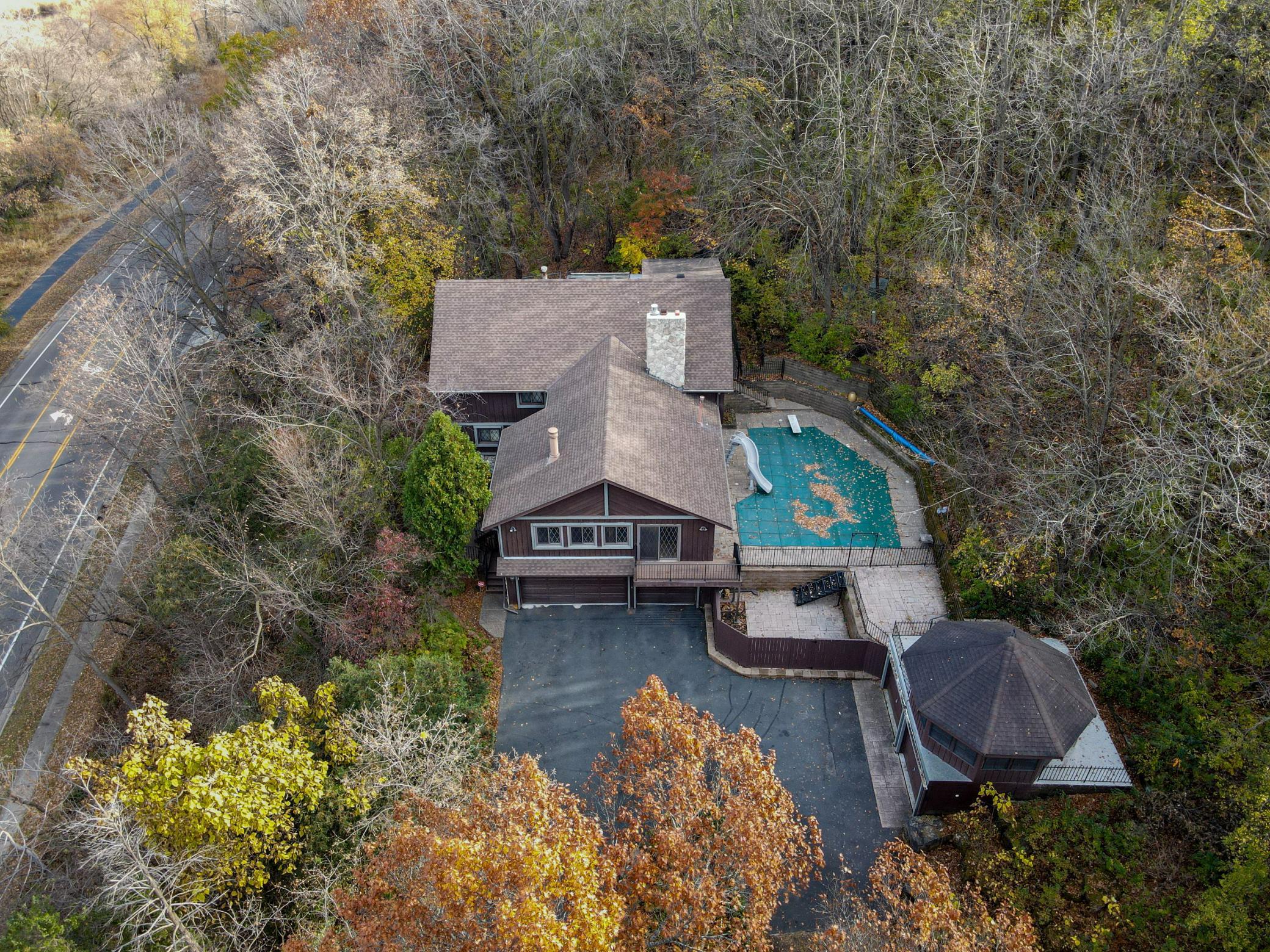 Tucked in the woods with a heated, in-ground pool.
