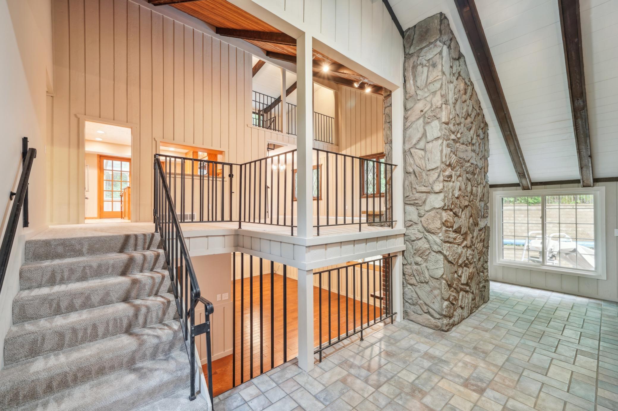 Entry level affords views of the many various living and entertaining spaces.