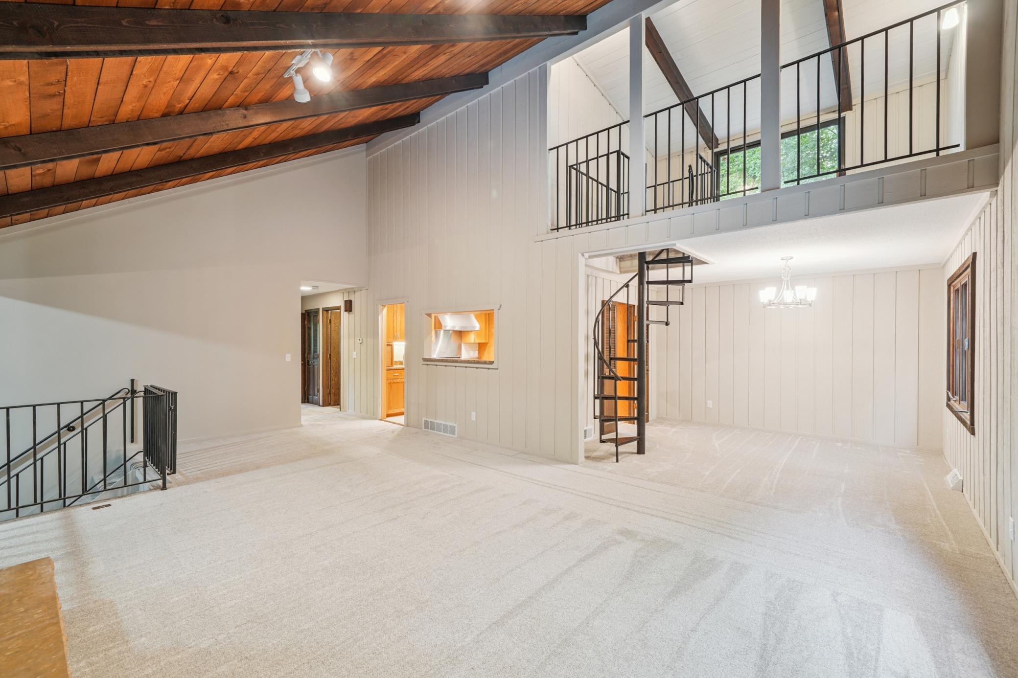View back towards kitchen and upper level two bedrooms