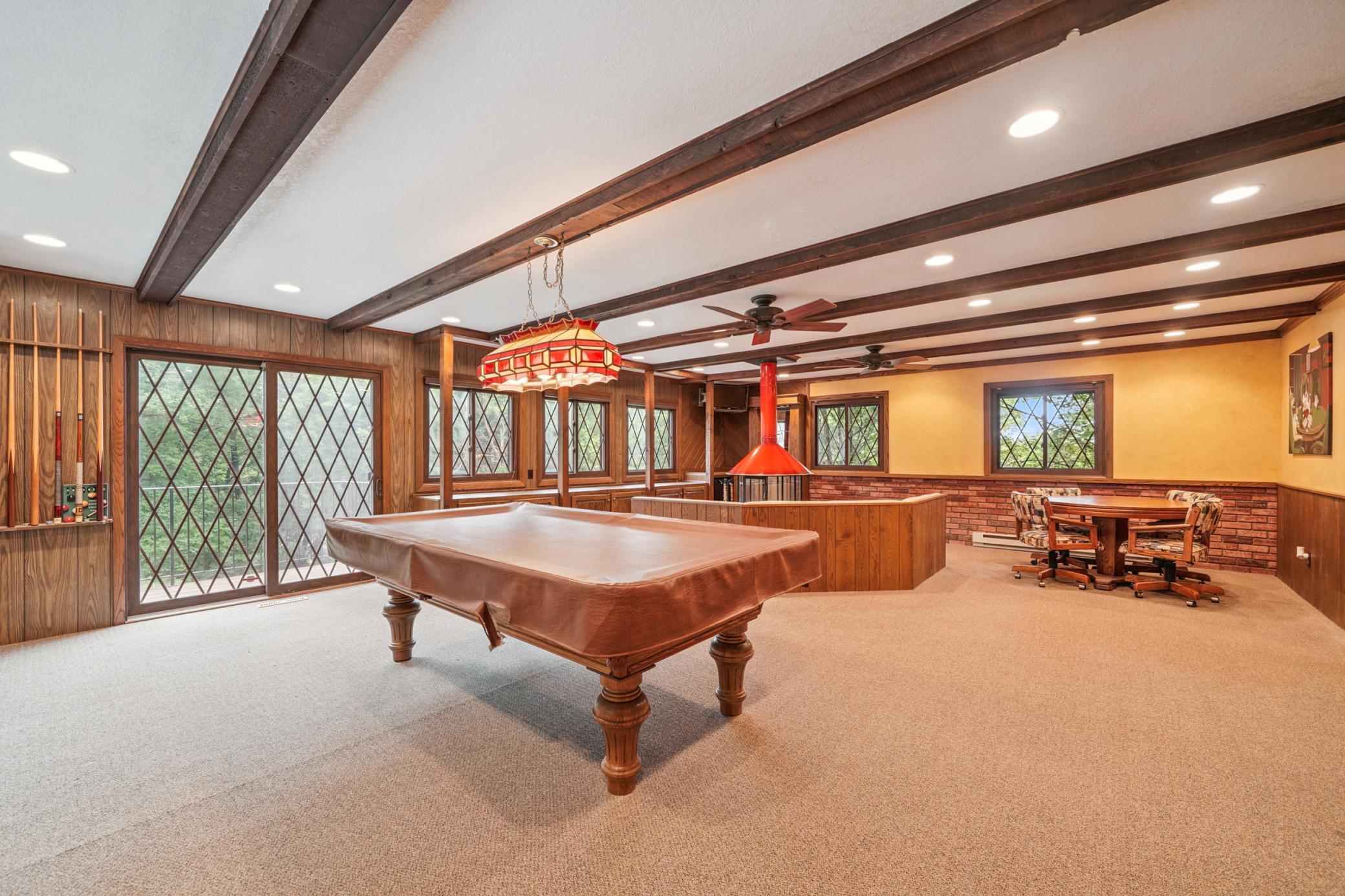 Game room with access to outdoor pool area