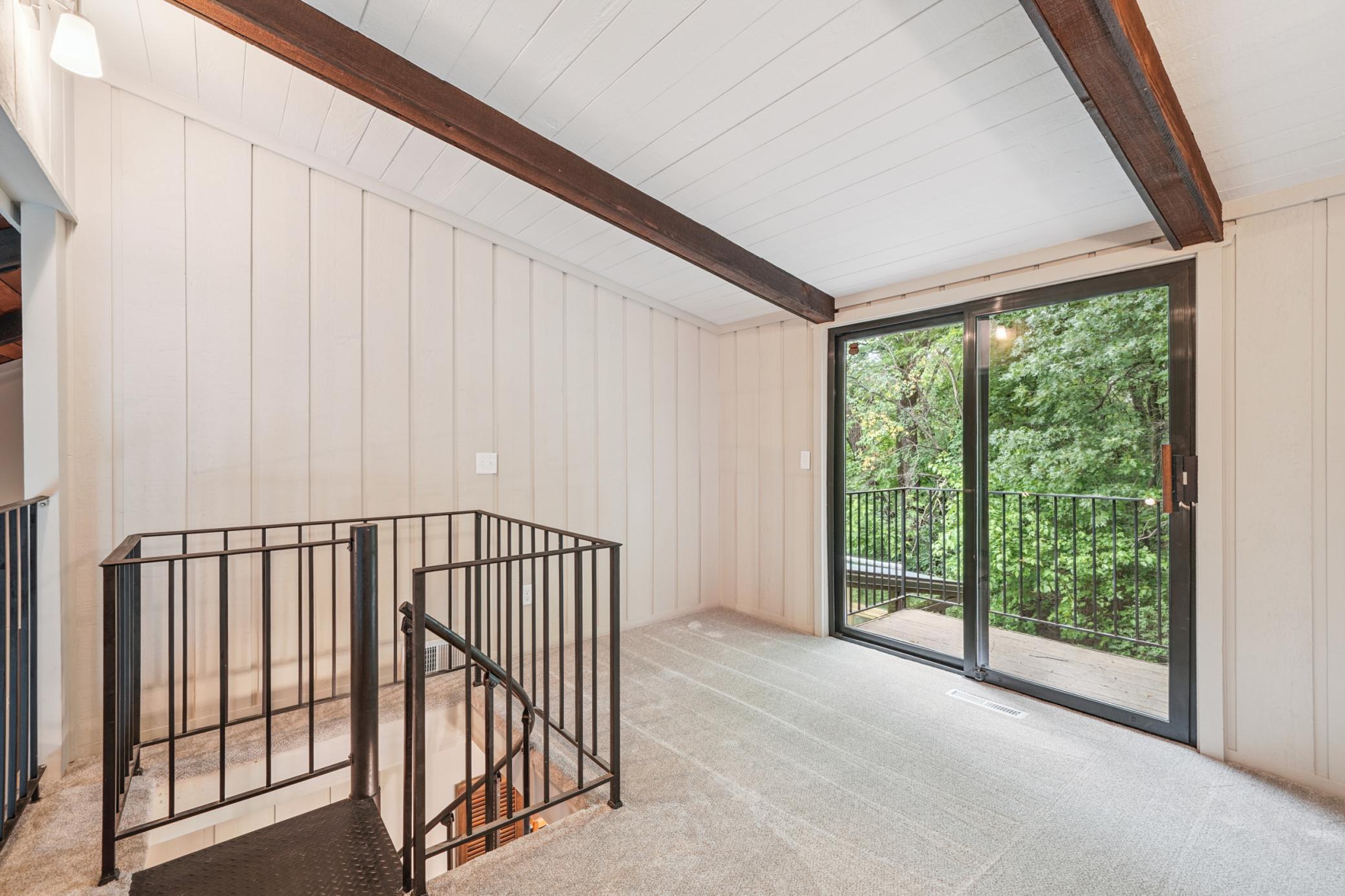 "Crows" nest area with private deck and spiral staircase to dining room.