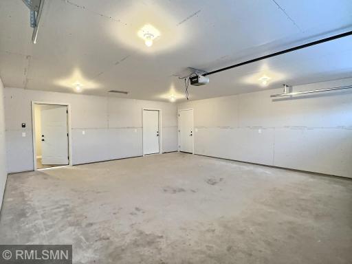 The interior of the garage is insulated and sheet rocked and this is where you access the mechanical room.
