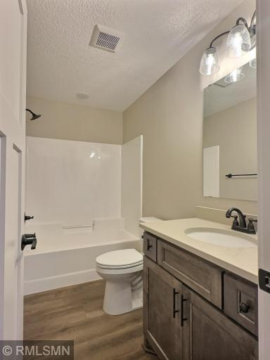 The 2nd bathroom is a full bath that is conveniently located off the 2nd bedroom and main entertaining area of the home.