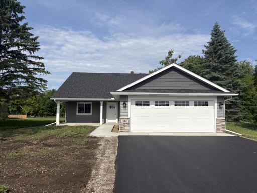 The 2 car attached garage will be insulated and sheet rocked. The asphalt driveway has been completed and yardwork will begin. Can close quickly.
