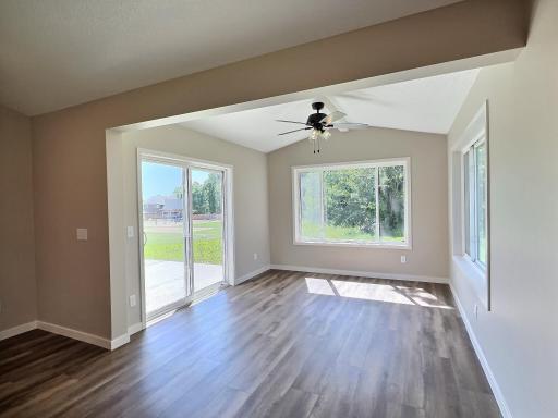 The sunroom is off the back side will stream with natural light and walks out a spacious back patio that overlooks the community park and an open area of the park.