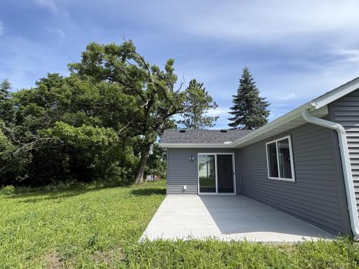 Open spacious patio off the sun room ideal for outdoor entertaining and relaxing. Great view overlooking the community park and green space.