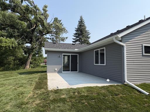 Open spacious patio off the sun room ideal for outdoor entertaining and relaxing. Great view overlooking the community park and green space.