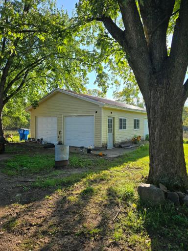 A detached oversize 2 car garage with 3rd overhead door for additional space.