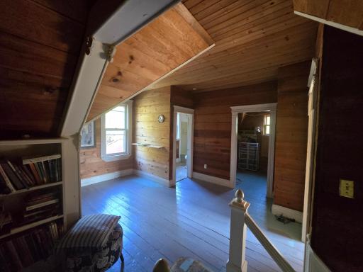 View of upper level landing looking toward bathroom and sewing room.