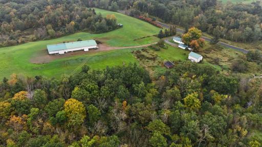 1189 315th Avenue Frederic. 16.4 acres with the Wood River running through. Cute house with a massive 160x50 pole building, horse barn, and more!