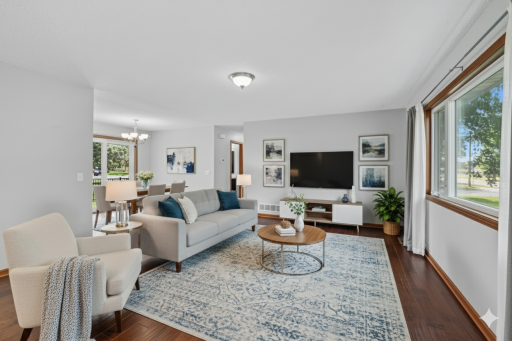 Welcome to 7717 Able Street NE. Living room virtually staged.