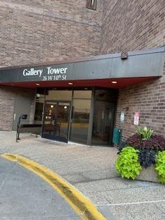 Secured entry with two electronically controlled doors and call box.