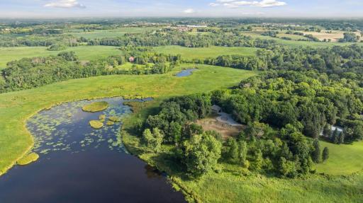 Located on the peninsula of a pond, this site offers expansive natural views.