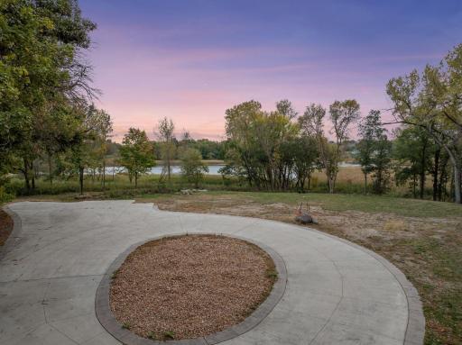View from auto-court to front yard and pond.