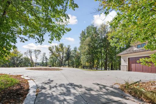 View from auto-court to front yard and pond.