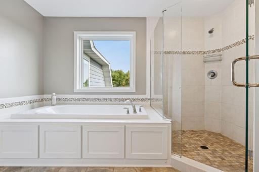 Primary bathroom soaking tub and separate walk-in shower