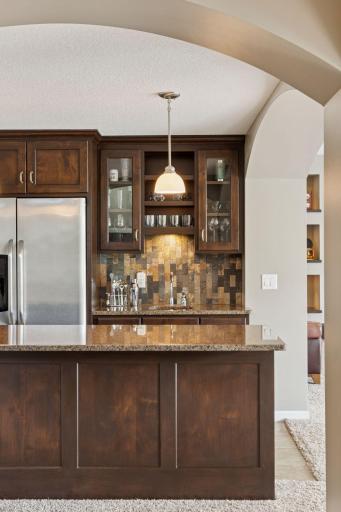 The beautifully appointed bar inside and another just steps away on the pool deck is an entertainer's dream!