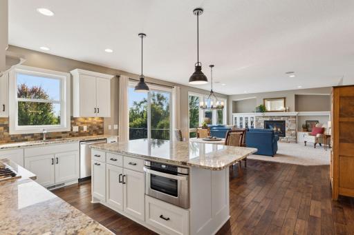 The view of the gourmet kitchen and living room when entering from the mudroom.