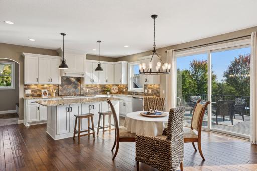 The gourmet kitchen features an island that seats five.