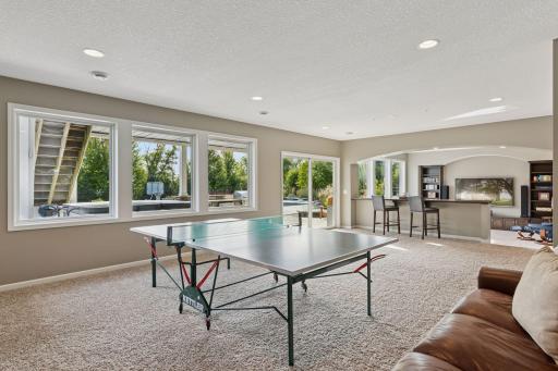 The pool and hot tub are ready for you, just steps from the lower level family room.