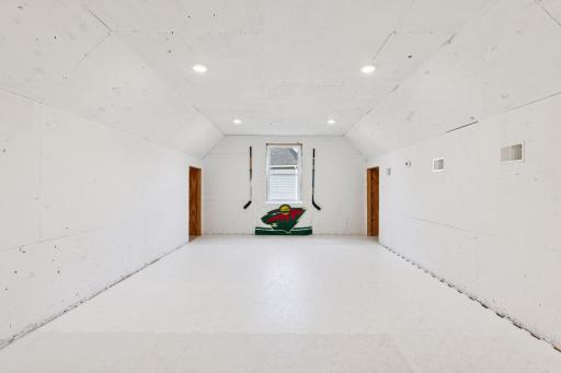 Just up the stairs in the outbuilding is a hockey lovers dream - an indoor skating practice space for the sports enthusiasts in your life!