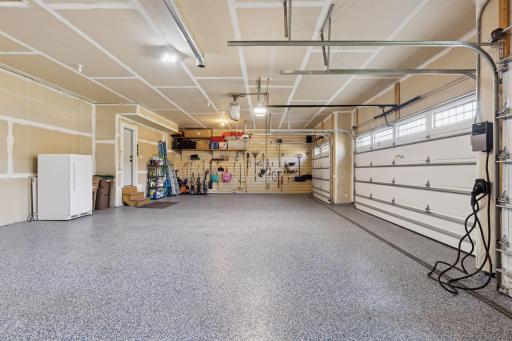 The garage walls on either end are outfitted with efficient organizer systems - helping you keep track of your tools and essentials.