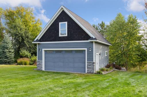 This special outbuilding, currently used for additional storage, is ready to transform into your dream space! Imagine an art studio, workout gym, or bunk house! And that's just the lower level!